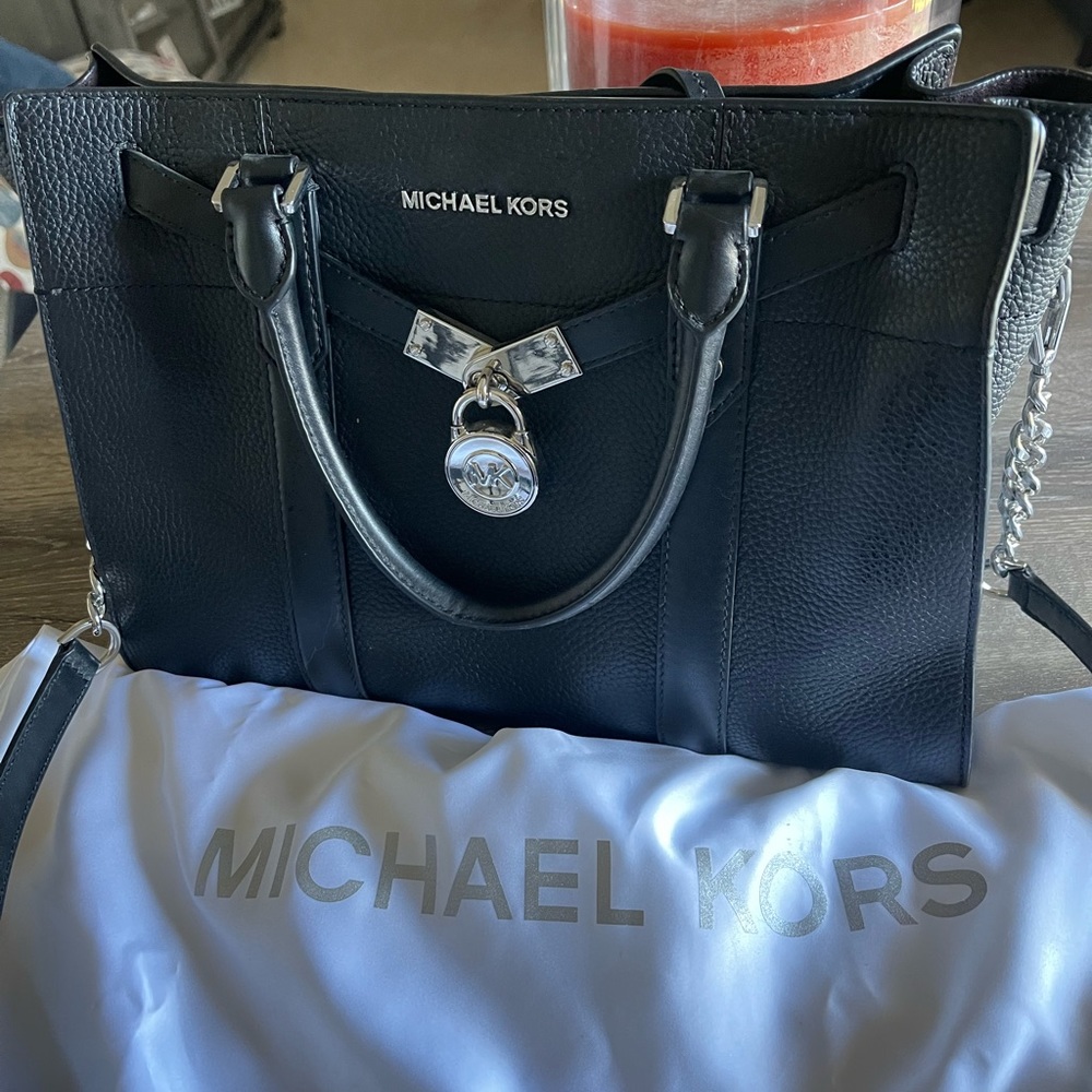Sold.   Authentic Michael Kors handbag and wallet